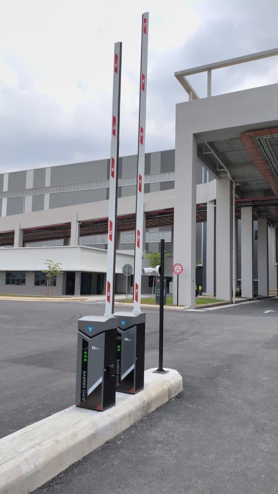 Twin barrier gates at a logistics facility